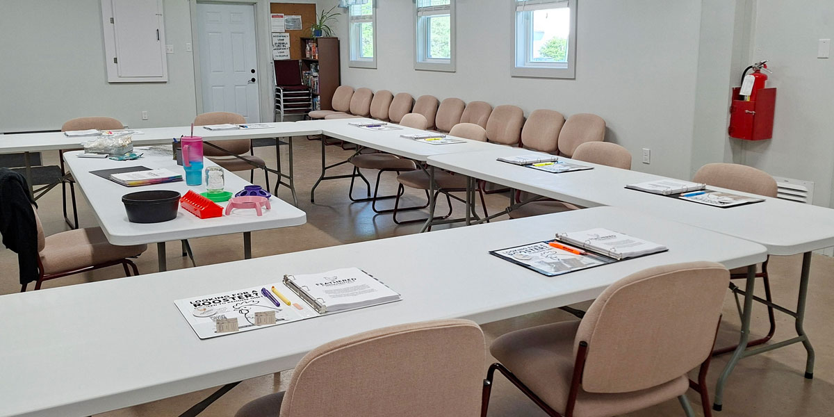 A classroom arranged for a Feathered Fundamentals beginner chicken-keeping workshop.